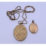 A 9ct yellow gold oval locket engraved leafage scroll to the front, on box-link chain together