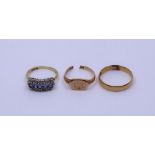 A collection of gold rings (3)