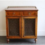 An Edwardian Sheraton revival cabinet with galleried top