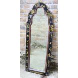 An early 18th century style black-lacquered mirror in a fiat-sprigged arched flat frame