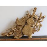 A carved giltwood musical trophy fragment