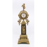 A Victorian style brass columnar mantel clock by Meridian of pierced foliate design and surmounted
