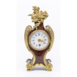 A late 19th century French tortoiseshell and git brass mounted mantel clock, the white enamel dial