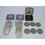 A collection of British Monarchy commemorative coins comprising:- six commemorating Queen