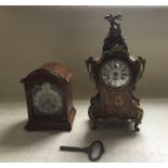 A Davall carriage clock, mahogany case H 13cms), and a French style marquetry and ormolu clock,