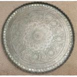 Large brass tray, diameter 90cms, scallop edged border with natural decoration along with cartouches
