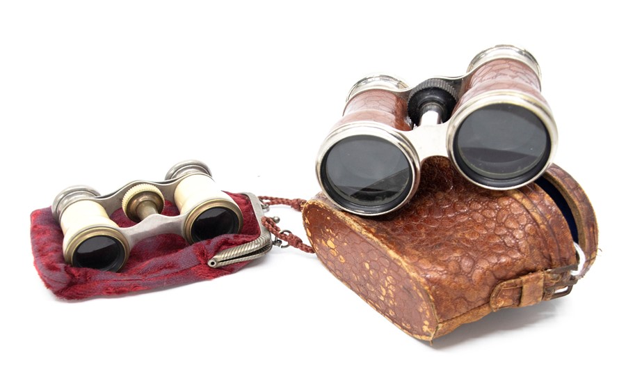 A pair of early 20th century "Le Jockey Club, Paris" opera glasses and a pair of late 19th century