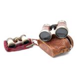 A pair of early 20th century "Le Jockey Club, Paris" opera glasses and a pair of late 19th century