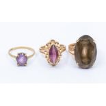 A collection of three gold stone set rings, to include a smoky quartz 14ct gold ring, size P and a