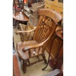A Victorian Elm & Beech slatted back armchair, turned legs, joined with turned stretchers.