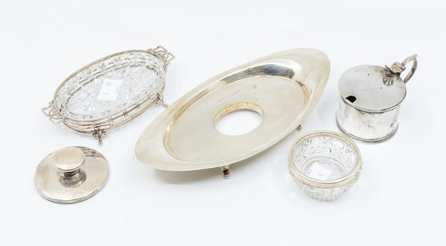 A collection of silver to include: an Edwardian navette shaped ink stand, on scroll feet, London,