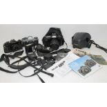 Collection of Canon cameras with lenses and accessories cased and uncased including flashes and