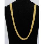 A 9ct gold multi link chain necklace comprising twenty strands of rope twist chain with bead