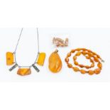 A collection of amber jewellery to include a irregular pendant approx 60 x 34mm, a string of