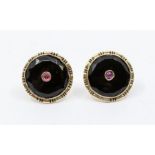 A  pair of Russian onyx and ruby 14ct gold earrings, circular form set to the centre with a ruby/