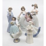 A NAO collection of figures, comprising 'Optimistic Duck', with box, 'Girl Praying', with box, '