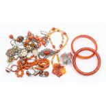A collection of carnelian jewellery to include bead necklaces, necklaces set in silver, white