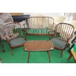 An Ercol three piece suite, comprising settee and two armchairs, together with a small coffee elm