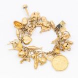 A 9ct gold charm bracelet including various charms, sovereign dated 1910, poodle, cat, harp fish
