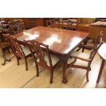 A modern mahogany dining table and a set of six chairs, in the manner of Chippendale