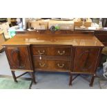 An early 20th Century mahogany sideboard, circa 1930, fitted with two cupboard sections and two