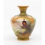 A Royal Worcester blush ivory vase, shape no: F112/H115.74, the body painted with perched Pheasants,