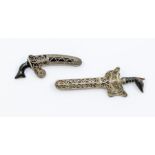 Two vintage Malaysian/Indonesian filigree and horn kris brooch, unmarked white metal  Condition