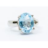 A blue topaz and silver dress ring, comprising an oval cut blue topaz approx 13 x 10mm, approx