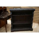 A late 19th Century oak ebonised chip carved open bookcase, circa 1870, possibly made in the Black