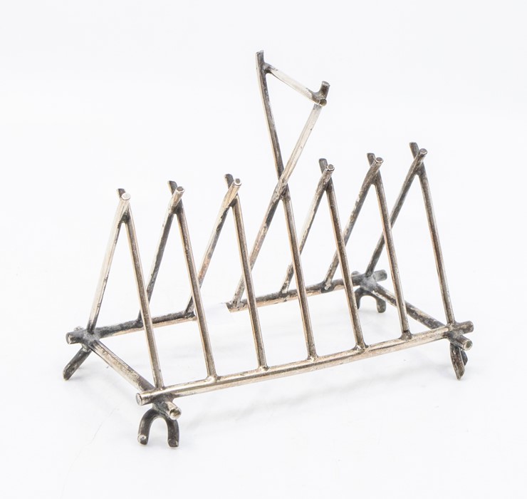 An electroplated 7 bar toast rack in the Dresser style, cross batton form, William Deykin & Sons