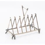 An electroplated 7 bar toast rack in the Dresser style, cross batton form, William Deykin & Sons
