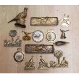 A collection of brass and copper ware to include door stops, plaques, horse brass etc - all chased