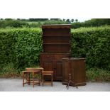 An Edwardian mahogany jardiniere stand, a linen fold panel narrow dresser, a rectangular standing