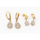Two pairs of 9ct gold and diamond set drop earrings, comprising a pair with pearl shaped claw set