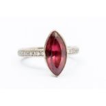 A rubellite tourmaline and diamond set 18ct white gold dress ring, comprising a marquise cut rub