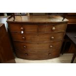 An early Victorian mahogany bow fronted chest, fitted with two short drawers over three long