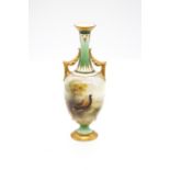 A Worcester Hadley's shape no: 211A/69.67 two handled baluster vase with jade green elongated