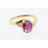 A Majestic ruby and diamond 18ct gold ring, comprising an oval cut ruby claw set to the centre,
