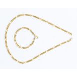 An 18ct gold curb link chain necklace, 53cm long, together with a matching gold curb link