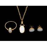 A 9ct gold opal necklace dress ring and earring set. The pendant necklace is fitted on a 9ct gold