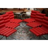 A set of six Italian Frag Canouan red leather swivelling bar stools, ribbed backs and seats,