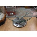 An Italian Naos ABRA swivel topped glass coffee table, the two glass surfaces swivelling round and