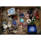 A collection of modern glass paperweights, along with other glass and crystal items