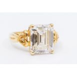 A 9ct gold and cubic zirconia dress ring, comprising a rectangular cut cubic zirconia, with fancy