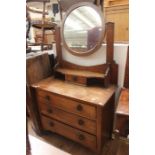 An Art Nouveau oak dressing chest, mirror backed, small drawer to top, three drawers to base,