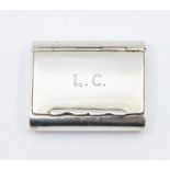 A silver snuff box, rectangular form initialled L.C, length approx 45 x 35mm, Birmingham 1933,