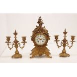 Late 19th century French brass mantle clock with candle Garnitures, Roman and Arabic numerals, 8