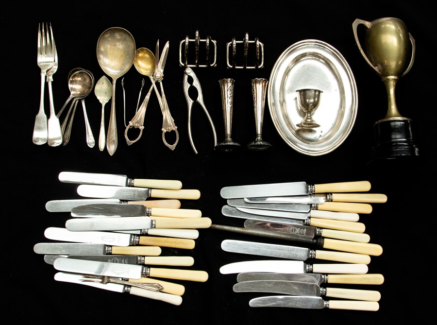 A quantity of plate, EPNS flatware to include: bone handled knives, servers, spoons, toast rack, nut