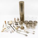 A collection of silver to include: pepper pot, caster top, trowel shaped page marker, toothpick