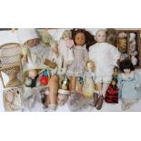 A collection of assorted modern and vintage dolls and dolls parts, all in varying condition. (two